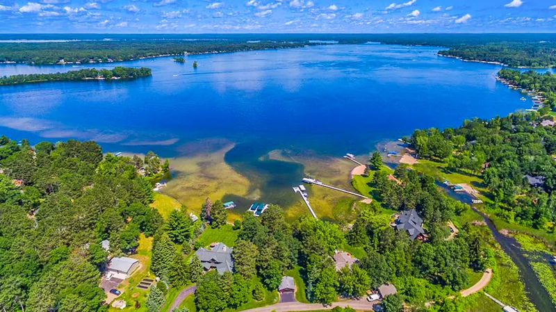 Aerial view over a Whitefish Chain bay and wooded shoreline near Crosslake